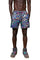 A man wearing psychedelic shorts with rainbow reflective panels from Love Khaos.