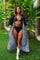 woman wearing a zebra print kimono with feathers from Love Khaos.