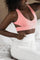 Pink lounge bra with white joggers made from eco friendly recycled plastic fabric by Ekoluxe sustainable loungewear brand
