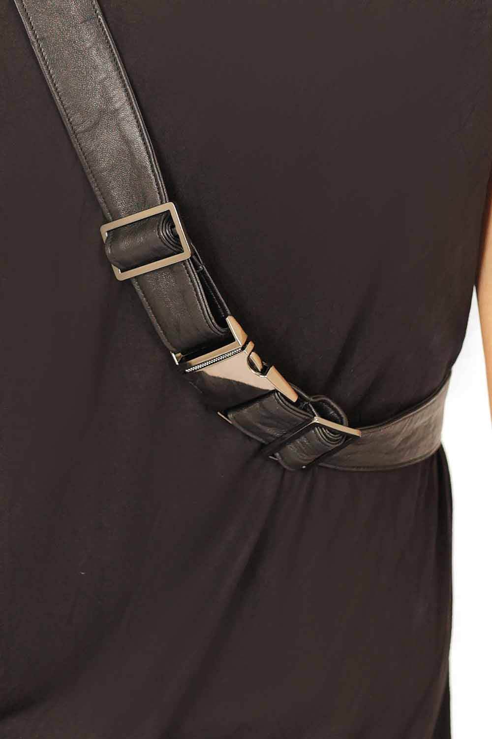 Buckle of a black leather sling bag from Love Khaos