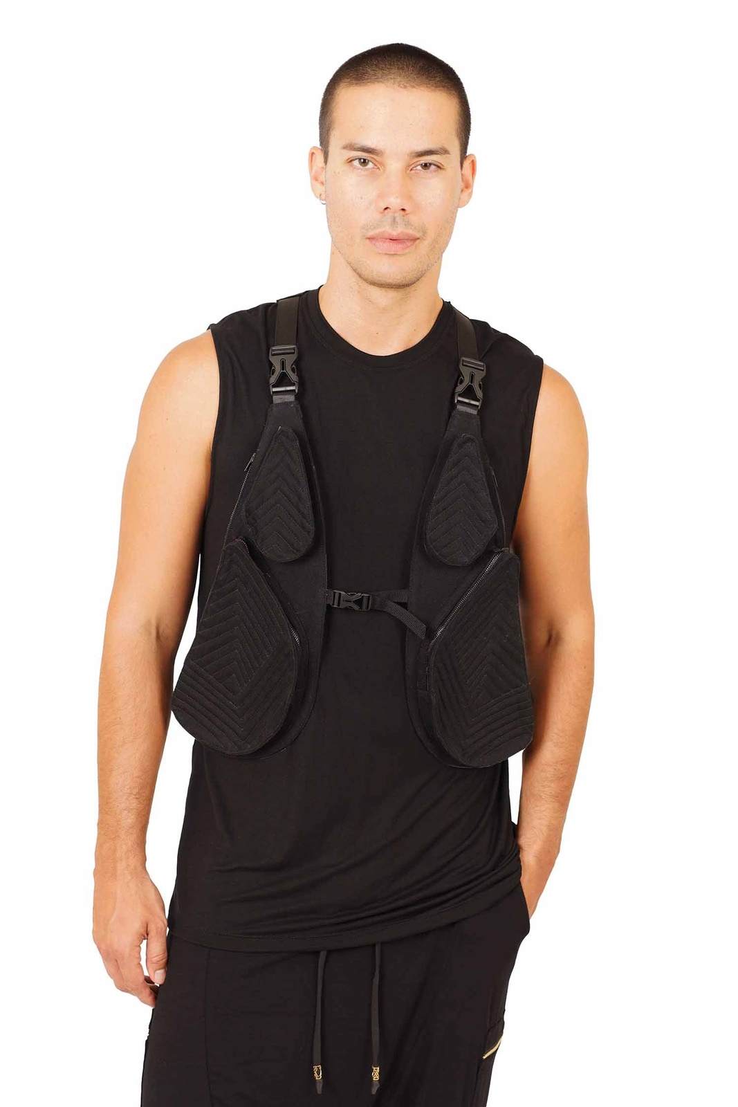 man wearing a black tactical vest from Love Khaos.