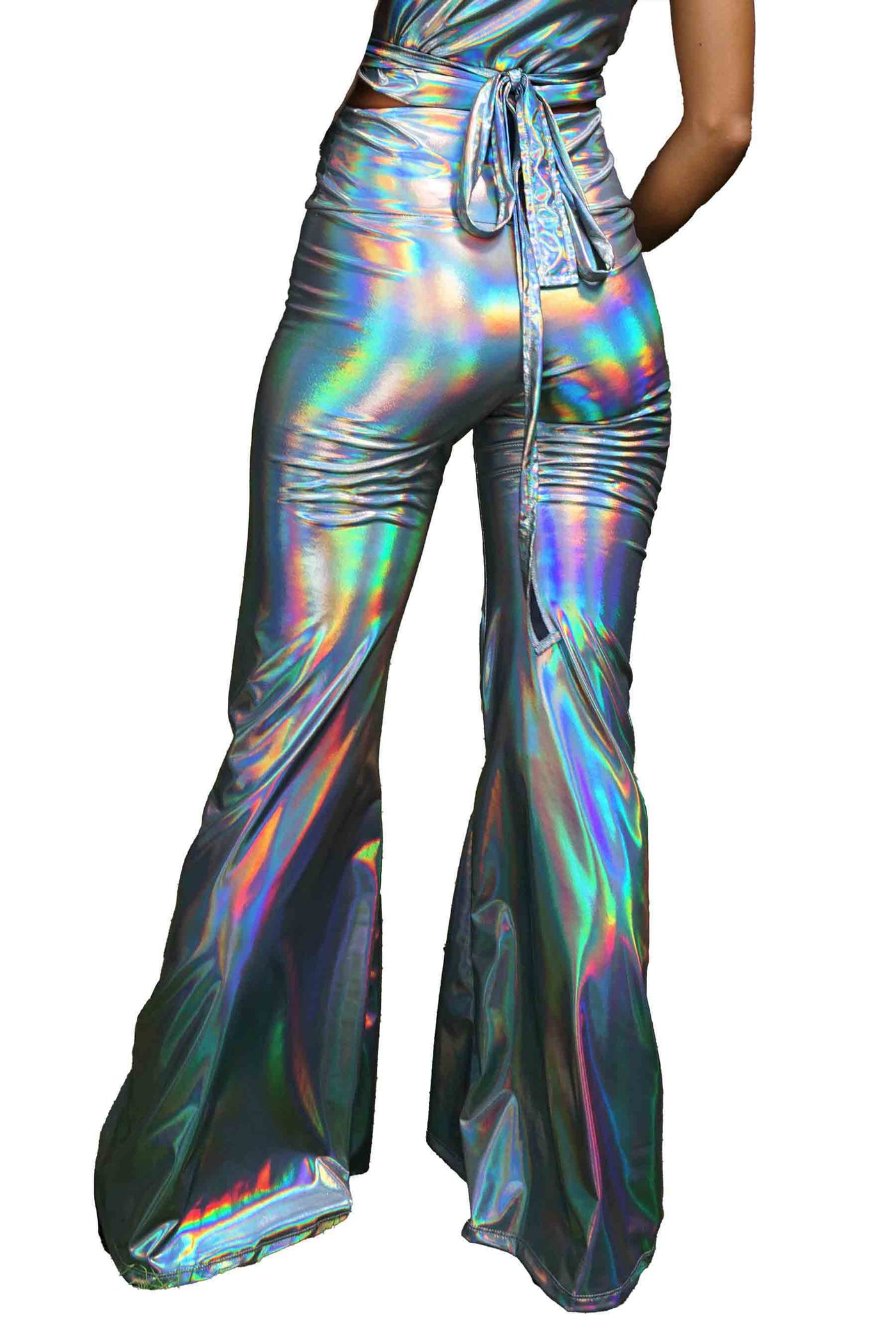 a woman wearing holographic silver bell bottoms from Love Khaos