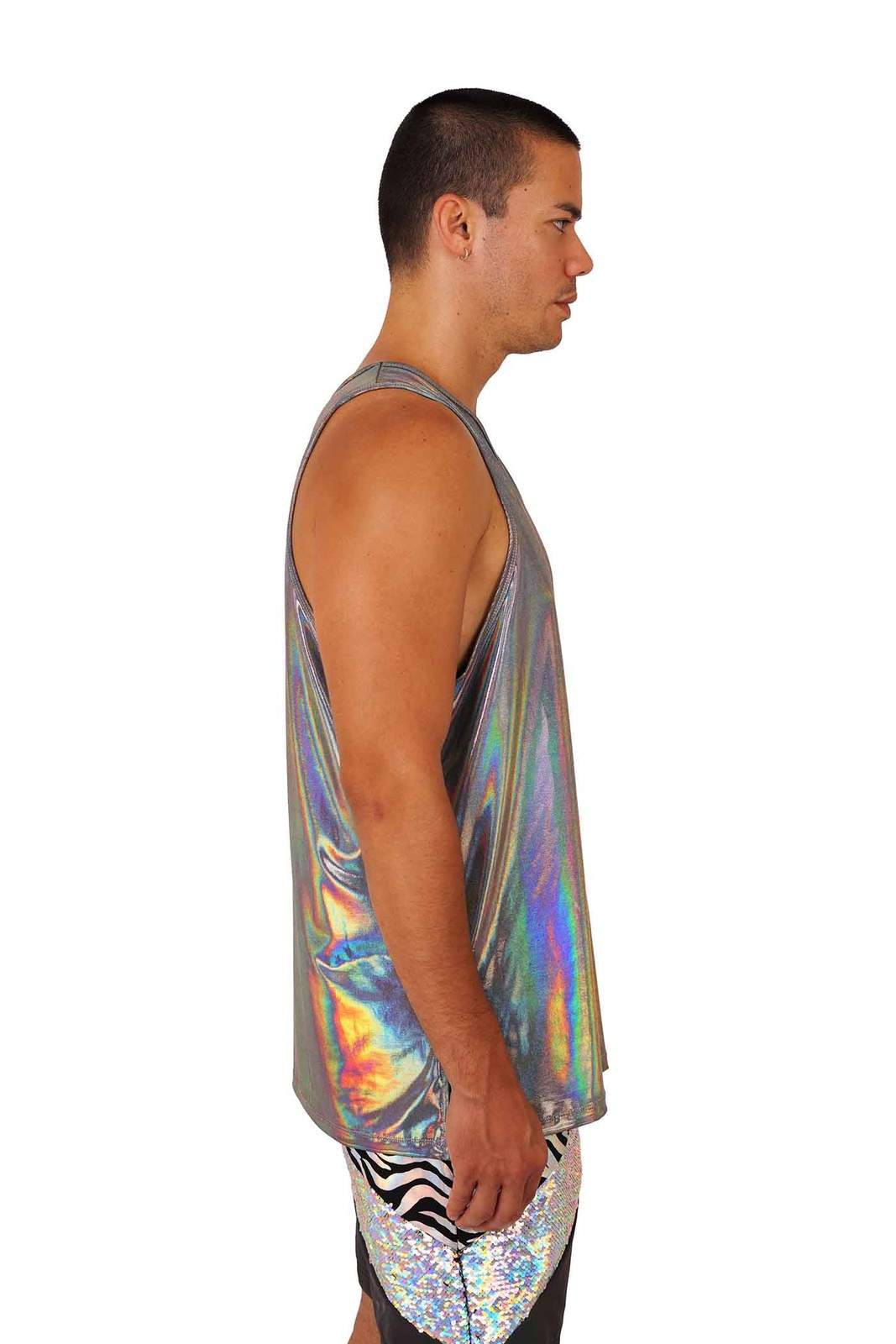 man wearing a holographic silver loose tank top from Love Khaos.