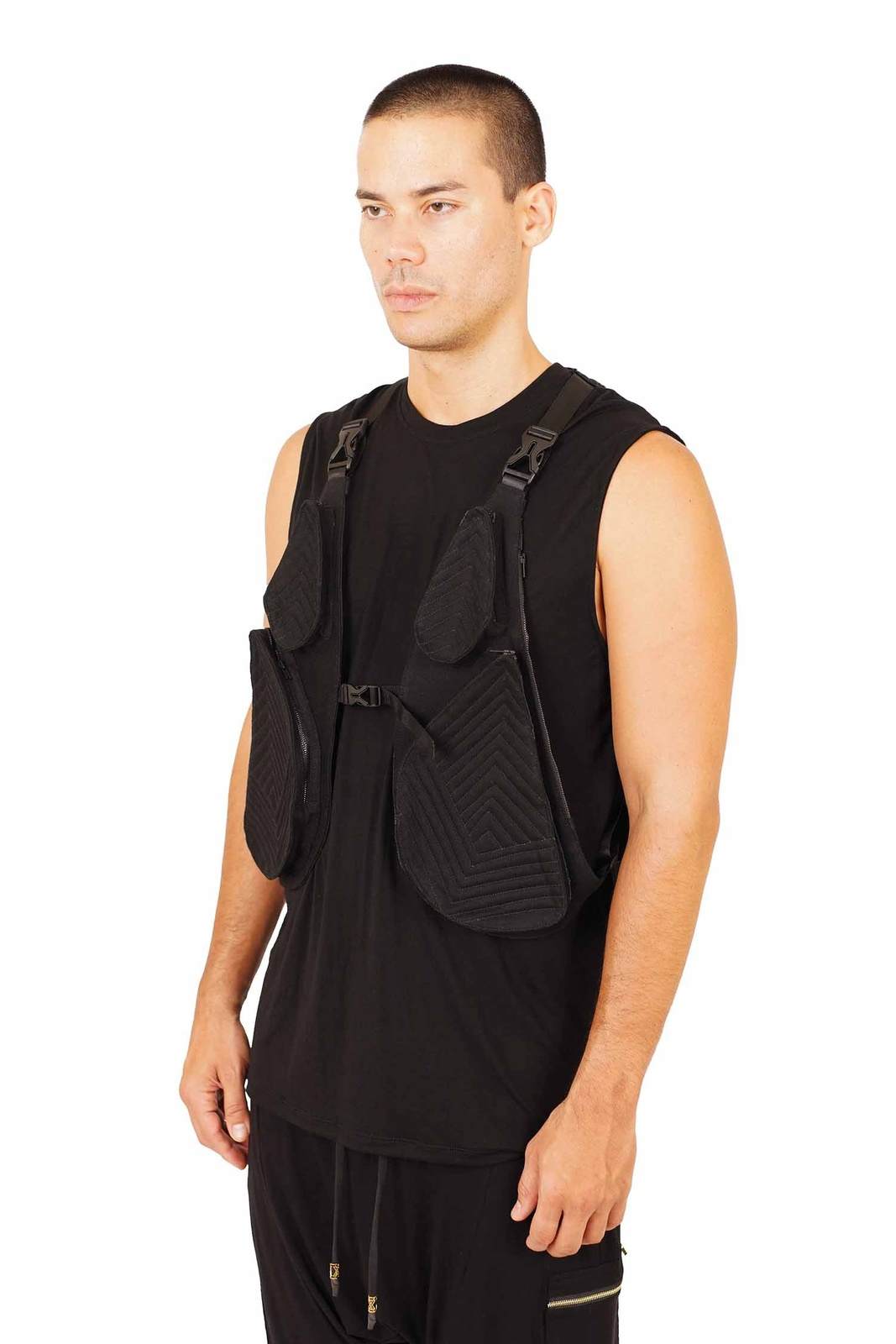man wearing a black tactical vest from Love Khaos.