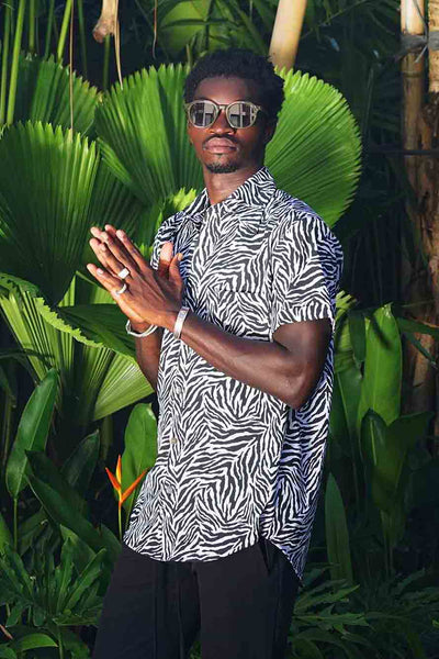 man wearing a zebra print dress shirt from Love Khaos