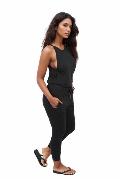 Woman wearing a Womens Black Casual Jumpsuit from Ekoluxe.