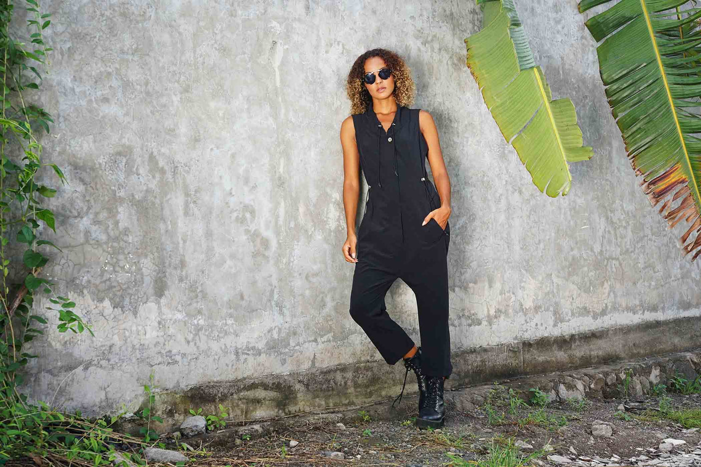 woman wearing a black jumpsuit from Ekoluxe