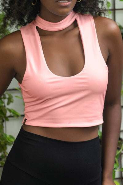 Sexy crop top in Pink and high waisted black leggings made from eco friendly recycled plastic fabric by Ekoluxe sustainable loungewear brand