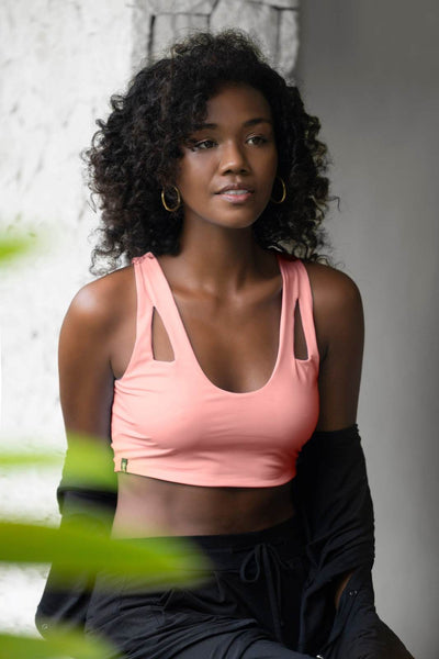 Peachy pink cute cropped tank top and black harem pants by Ekoluxe, a sustainable loungewear brand
