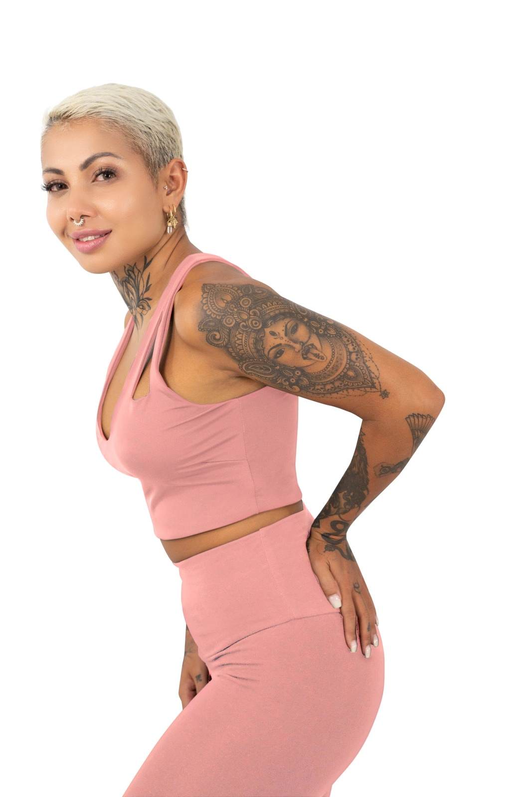 Cute cropped tank top in pink and matching pink high waisted leggings, a complete outfit set made from eco friendly recycled plastic fabric by Ekoluxe, a sustainable loungewear brand
