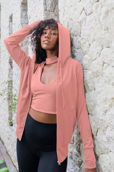 Sexy crop top in Pink and matching pink hoodie with zipper and high waisted leggings  made from eco friendly recycled plastic fabric by Ekoluxe sustainable loungewear brand  