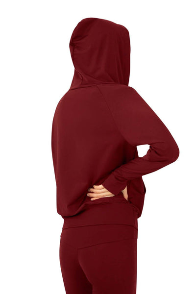 Thin zip up hoodie with matching leggings and bralette crop top in vino dark red made from eco friendly recycled plastic fabric by Ekoluxe, a sustainable loungewear brand