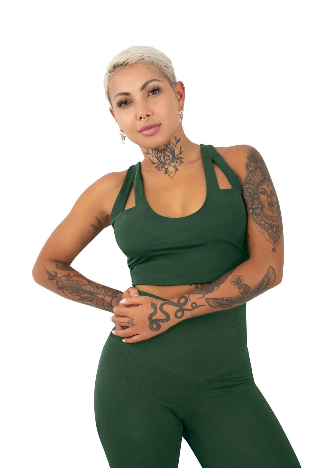 Seamless crop tank in evergreen worn with matching evergreen high waisted leggings, a complete outfit set made from eco friendly recycled plastic fabric by Ekoluxe, a sustainable loungewear brand